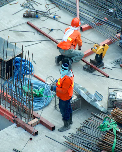 A crew works across a rebar deck